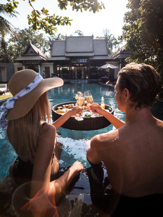 A couple at a pool