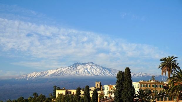 Taormina with Mount Etna clearly visible in the background.