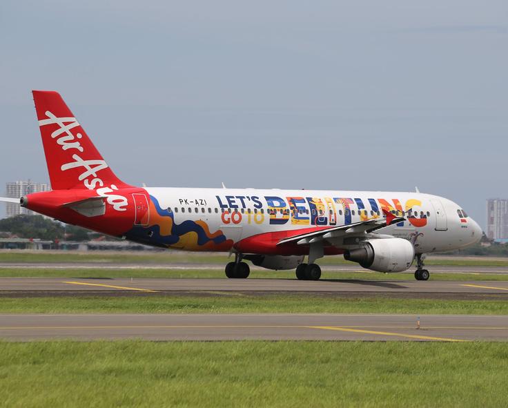 Shot of an Air Asia plane to explain that flying is the best way to go from KLCC to Penang