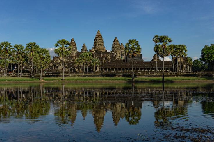 Frontal shot of the majestic Angkor Wat Temple, Cambodia reflected in the water