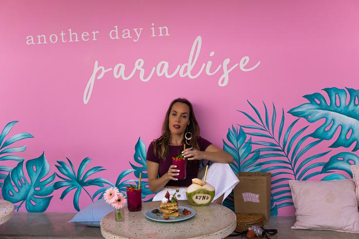 Girl in cafe in Bali having food