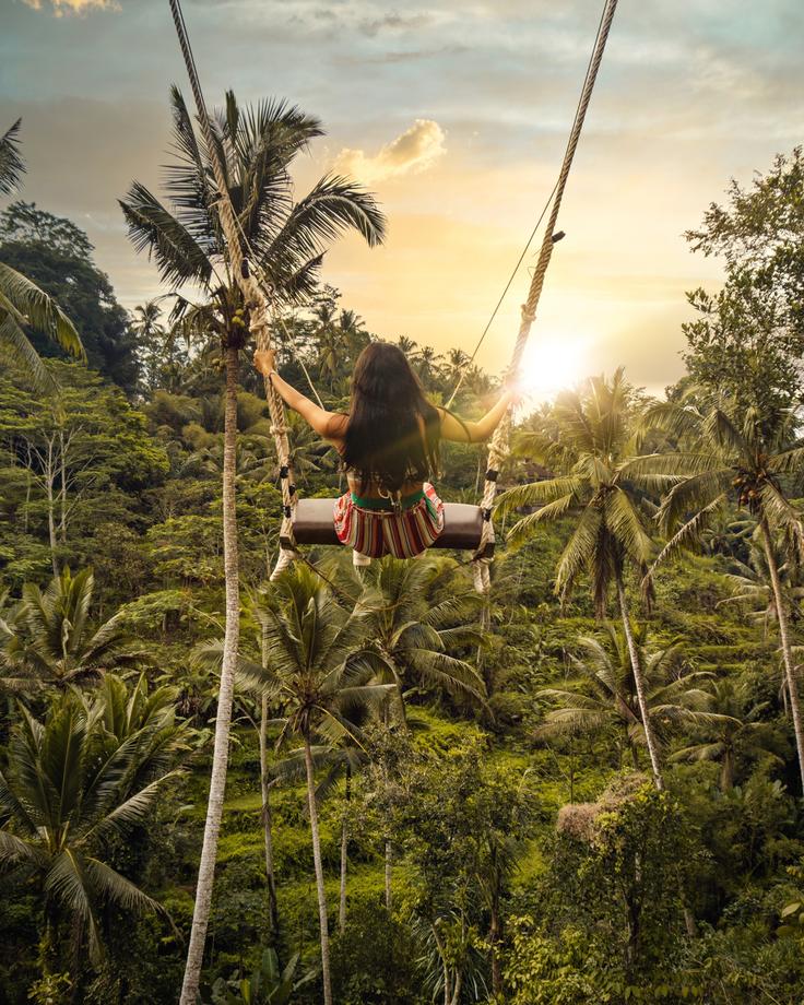 Shot of a girl in a swing in Bali