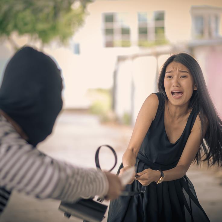 Shot of a girl being robbed in Bali in an isolated area