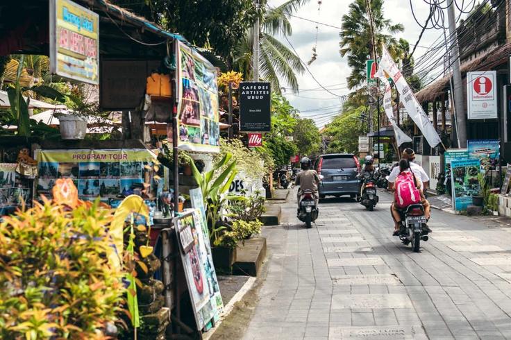 Shot of a popular road in Bali showcasing that there can be some local incidents on a scooter