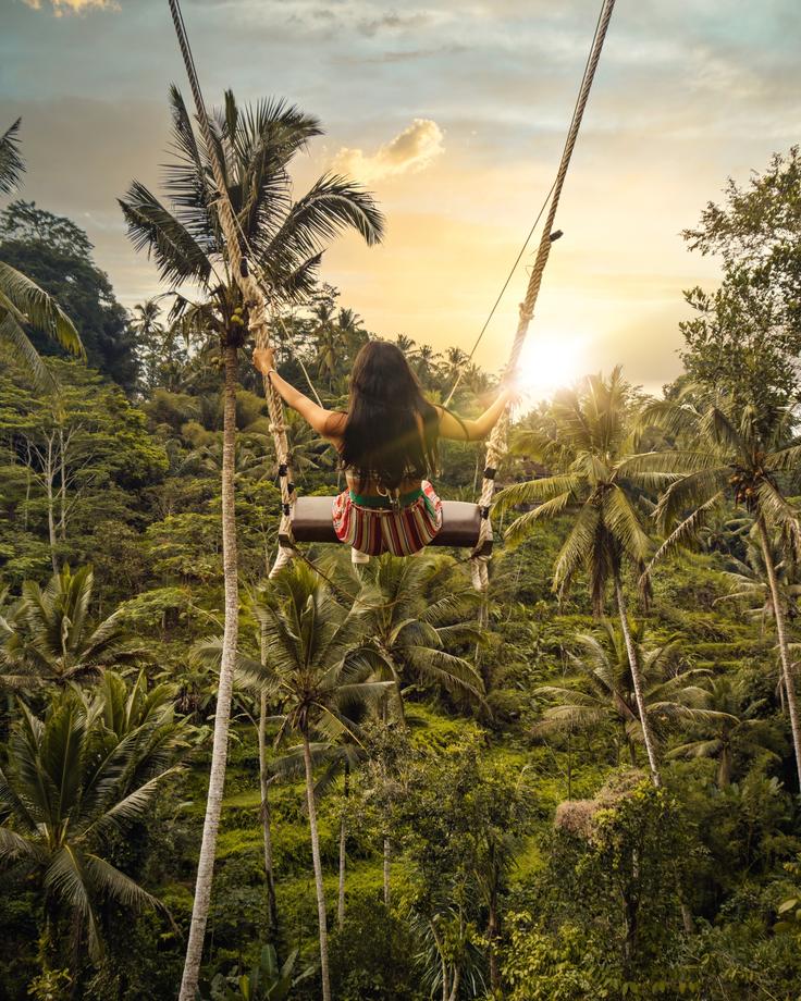 Soar above Bali's picturesque rice fields on a thrilling swing, immersing yourself in the stunning landscapes and capturing the essence of adventure and natural beauty