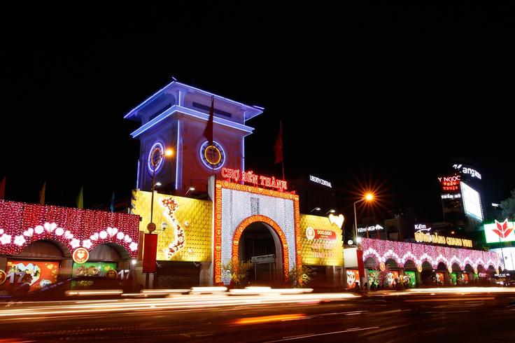 Frontal shot of the Ben Thanh Market in Ho Chi Mihn City at night with lights on