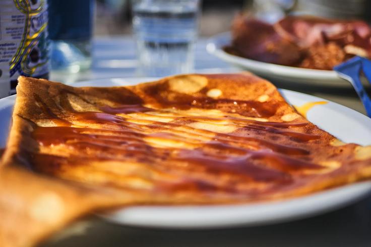 A crepe filled with Spanish jambon and cheese on a beach restaurant