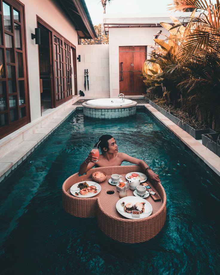 Tropical island breakfast by the pool in Bali