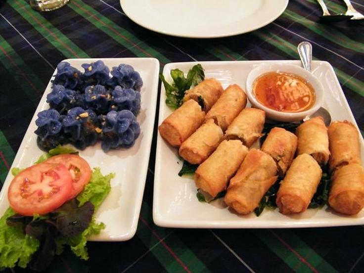 Shot of fried spring ralls and sticky rice pockets dish from Cabbages & Condoms  restaurant