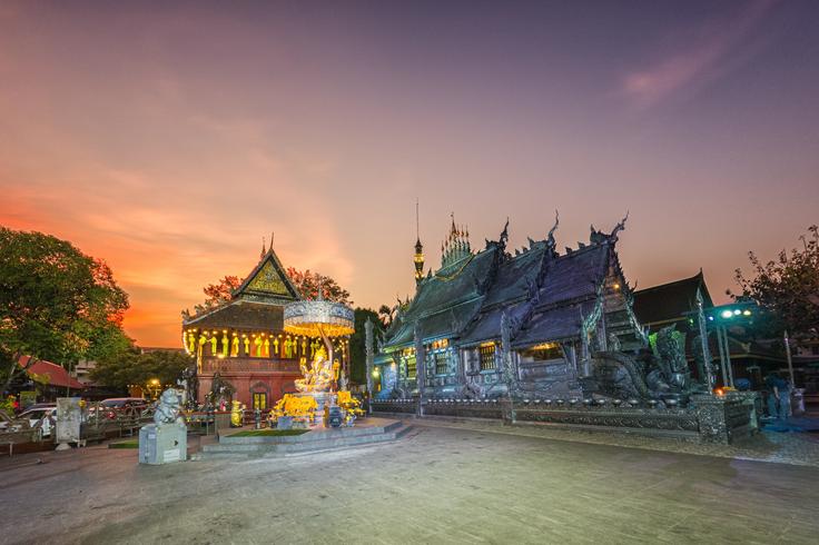 Silver temple in Chiang Mai at night with blue light tones