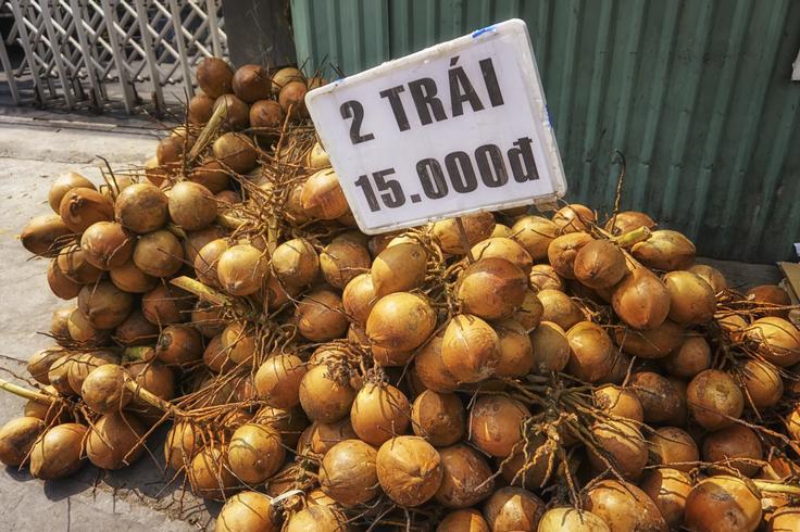 A pile of green coconuts showcasing the delicious street food culture in Saigon