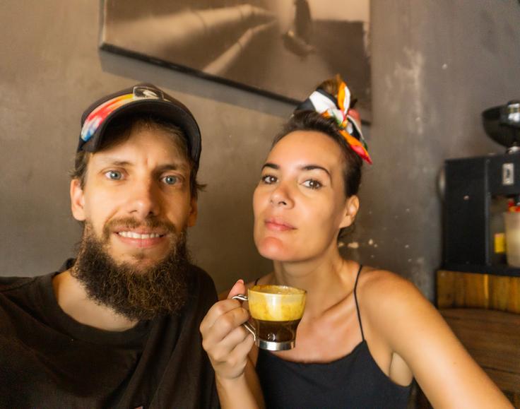 Frontal shot of a acouple having the traditionl egg coffee in Saigon