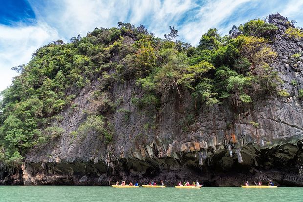 Kayaking along the turquoise waters in Phi Phi Islands.