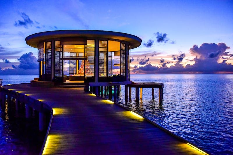 Romantic dining over the water is possible when going on a honeymoon to The Maldives