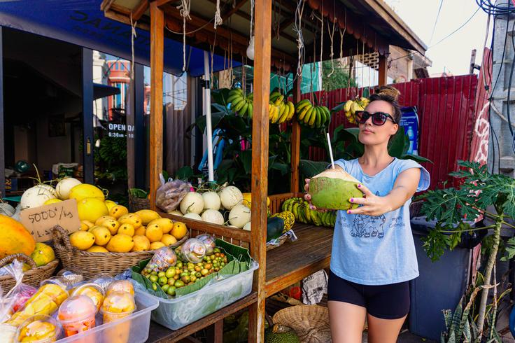 Girl shopping fresh fruit in Siem Reap, Cambodia