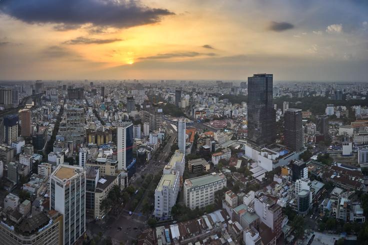 Panoramic sunsets views from the top inside of the Skydeck tower displaying all Saigon city