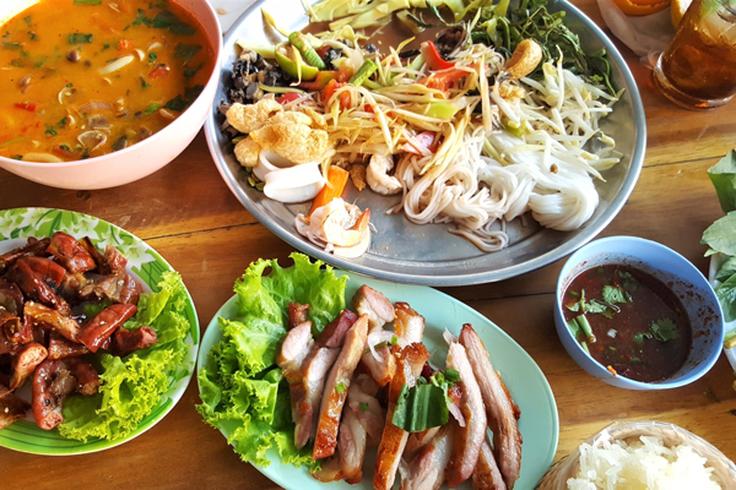 Frontal shot of Thai food table ful of the typical foods