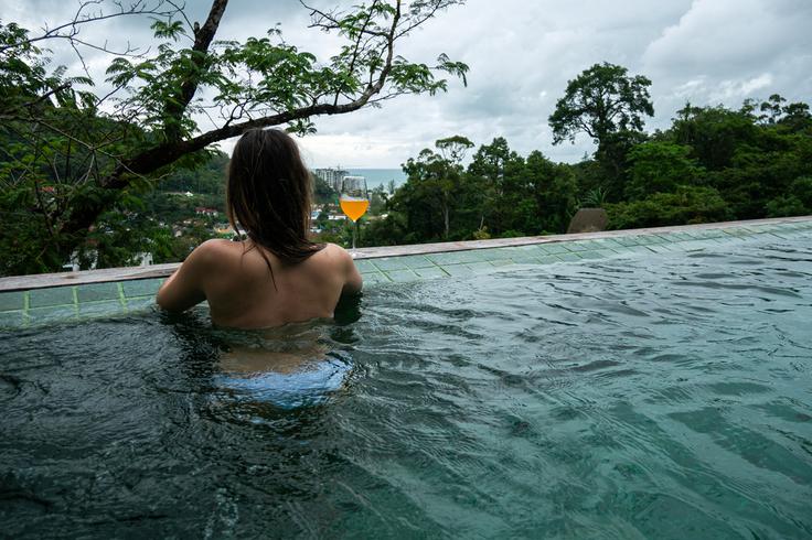 Shot of a girl in an infinity pool in Keemala Resort Phuket