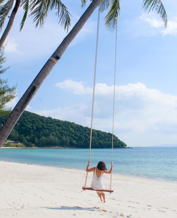 Shot of a girl relaxing in a swing in Koh Samui Island