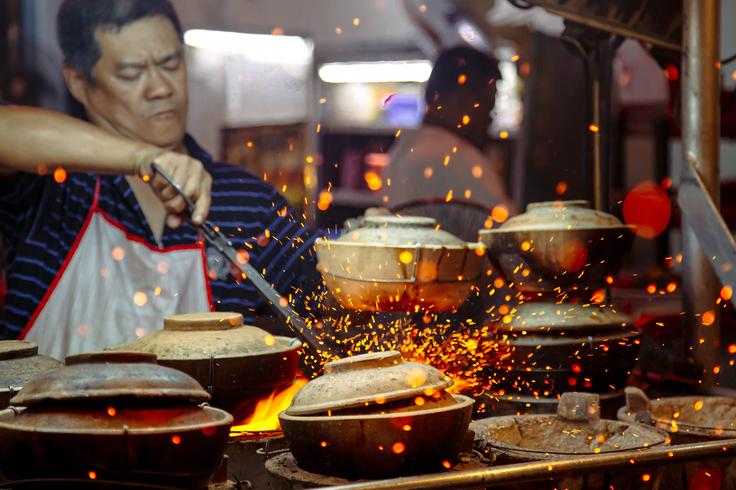 Shot of a chef in Kuala Lumpur cooking