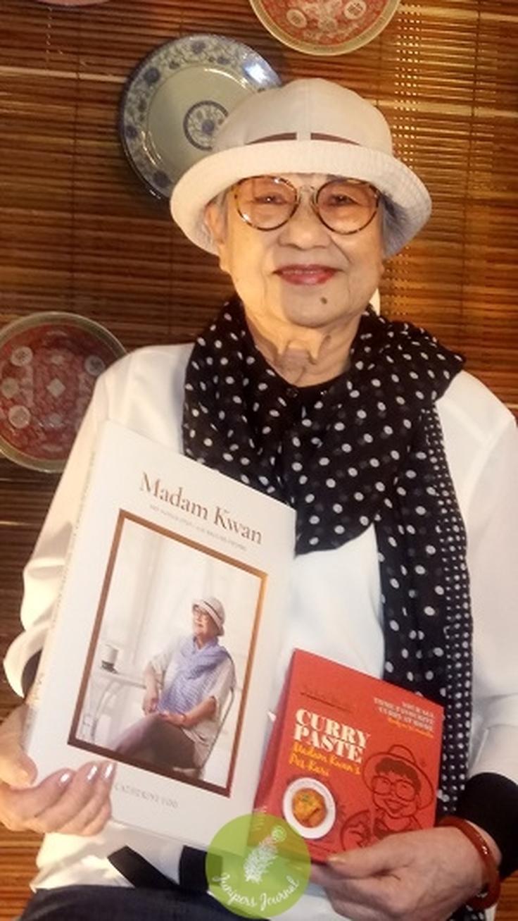 Shot of Madam Kwan at her restaurant showcasing her products!