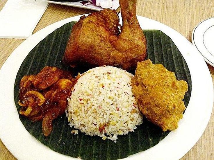 Shot of a dish with Nasi Bojari, beef rendang and cucumber!