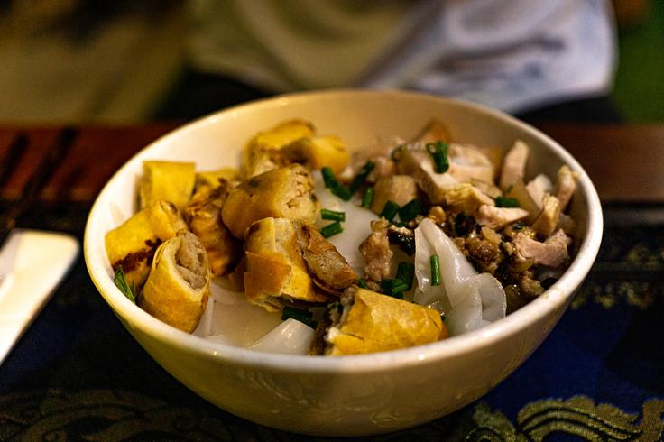 Shot of a typical dish with soup, noddles and vegetables in Phom Penh, Cambodia