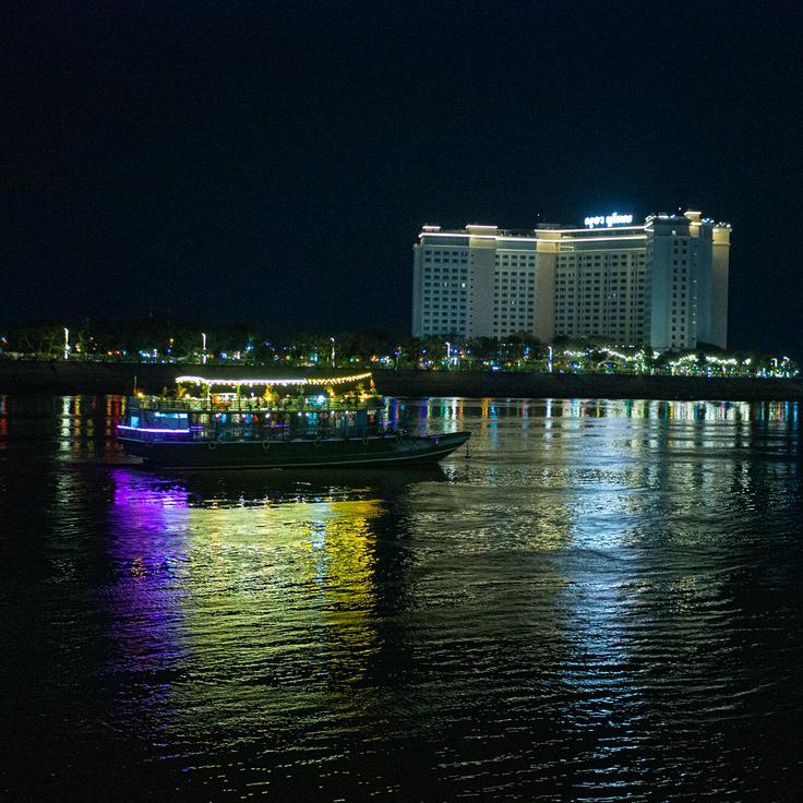 Shot of a party boat in the river at night in Phom Penh, Cambodia