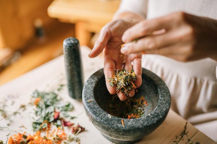 Shot of a morter with smashed spices and herbs showing the basis of Thai cuisine