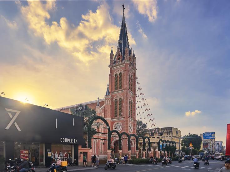 A beautiful colonial pink church that is landmark of the city of Hoo Chi Mihn city