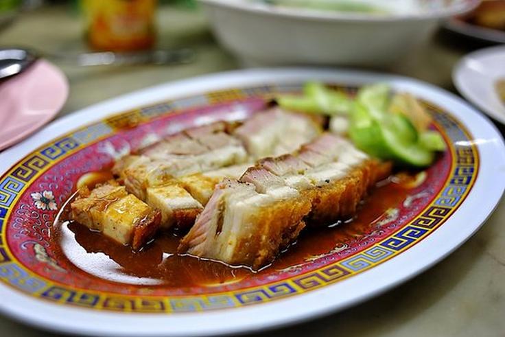 Shot of a crispy pork belly dish from Prachak Pet Yang