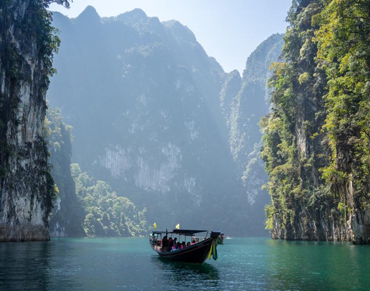 Shot of the typical long tail boat cruising the islands in Thailand