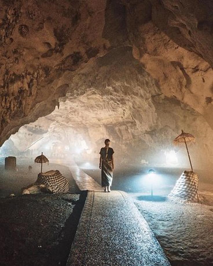 Shot of a girl walking on Pura Goa Giri Putri Cave