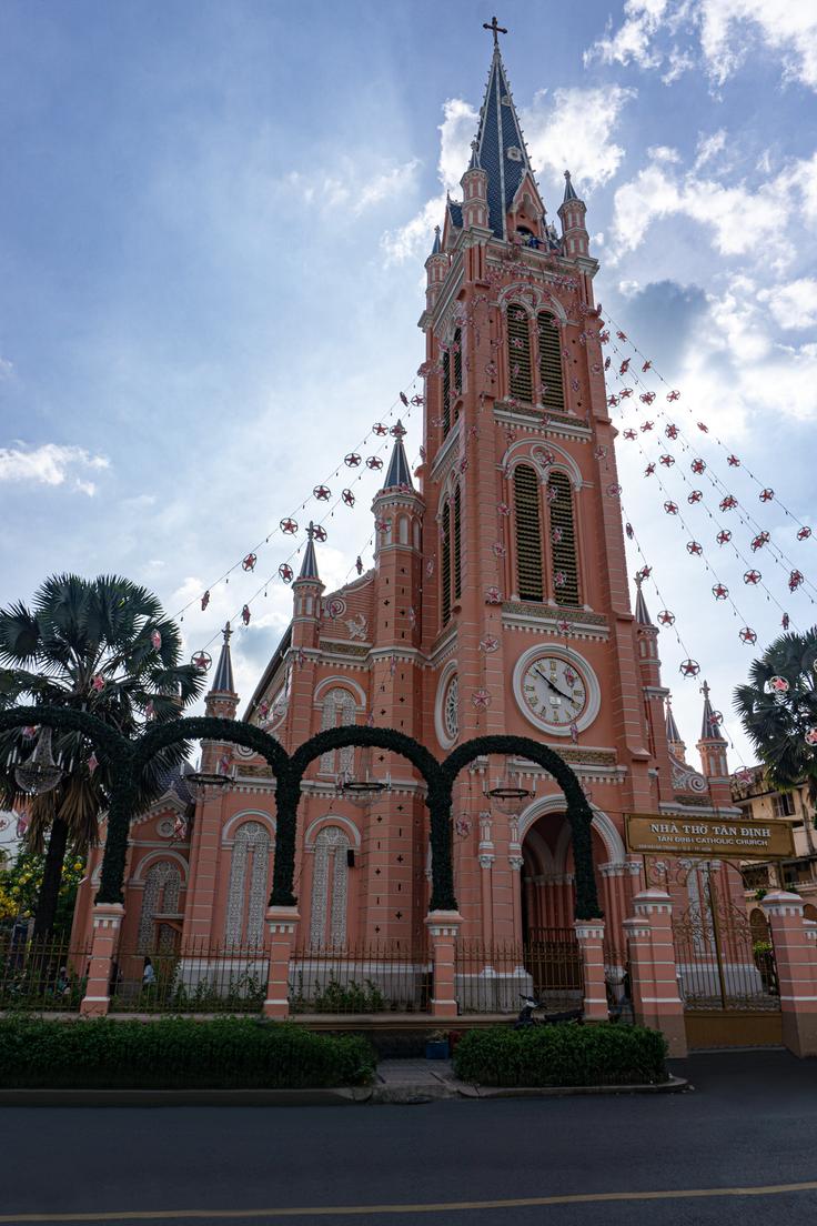 Frontal shot of The Pink Church of Ho Chi Mihn City in a summer day