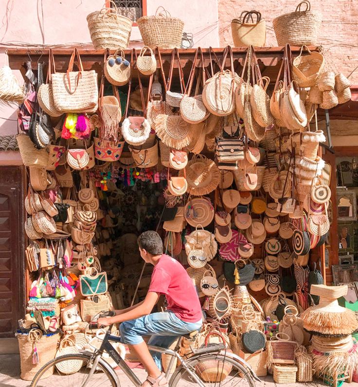 Frontal shot of a street market in Thailand with goodies like bags ready to sell