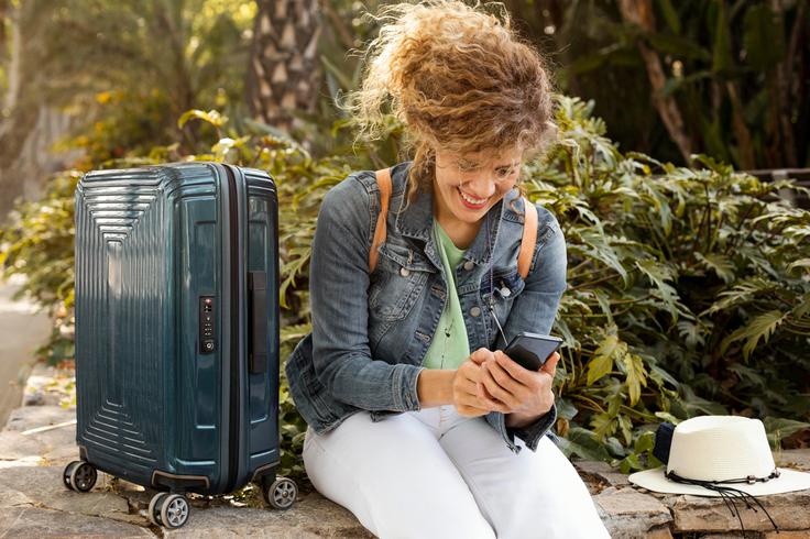 Sho tof a girl with her luggage showing solo femal travelling in KLCC