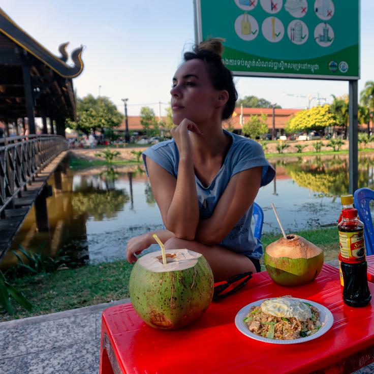 Girl having street food in Siem Reap, Cambodia