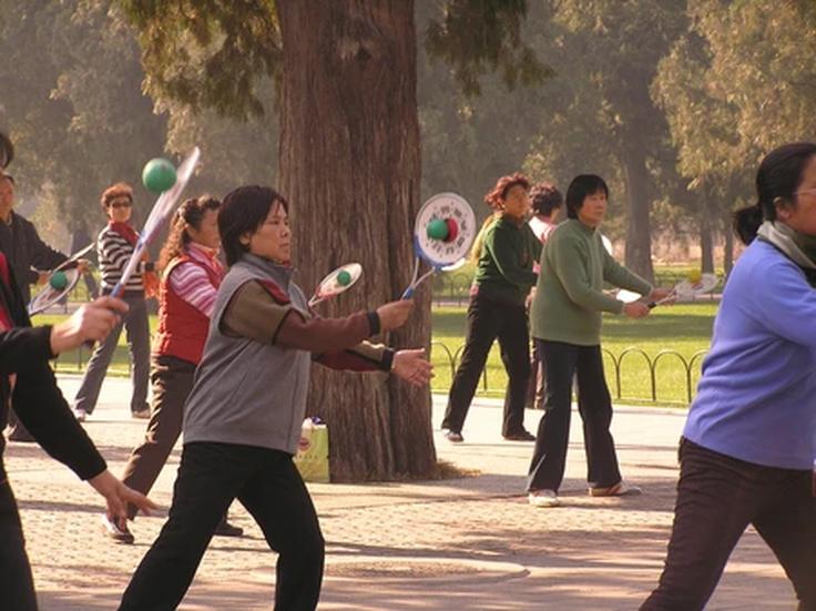 shot of old ladies performing the art of tai chi in Saigon's parks