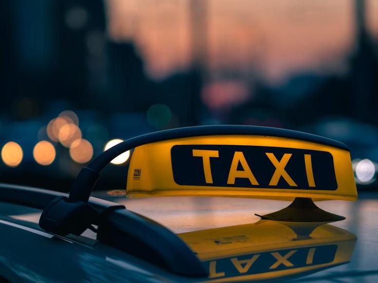 Shot of a taxi showcasing taxi scams in KLCC