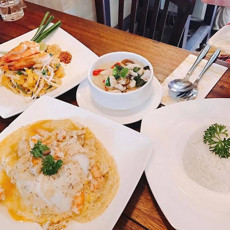 Shot of a king prawn Pad, yellow coconut curry and Thai pork omelette rom The Sixth – 6th restaurant