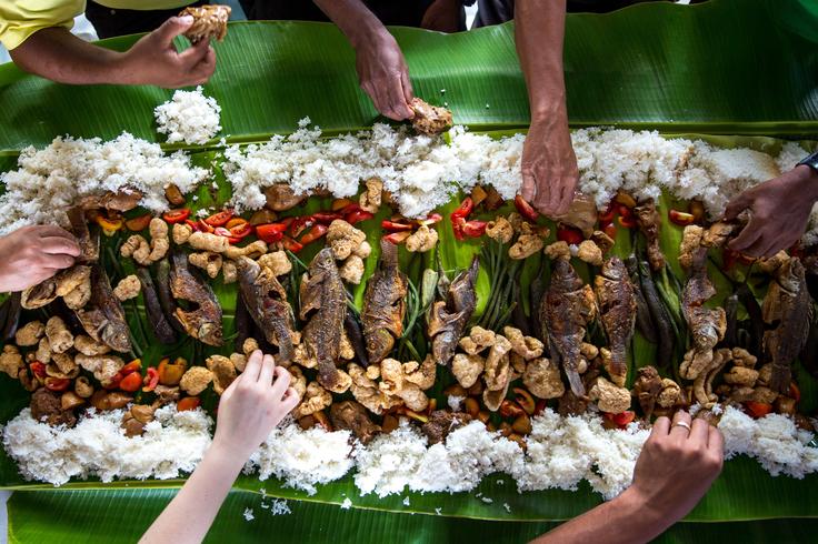 Experience the exquisite flavors and artistry of Balinese cuisine, a tantalizing feast for the senses, as depicted in the picture