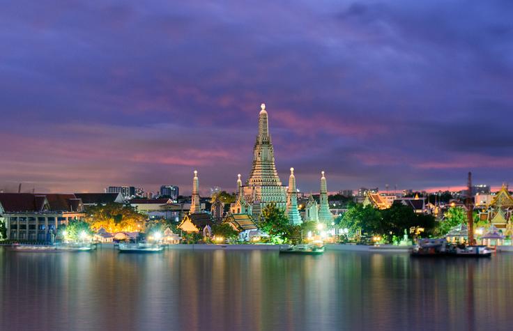 Shot of Wat Arun across  the river from a rooftop bar