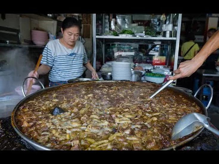 Shot of a meet stew over noodles dish, iconic from Wattana Panich In Ekkamai